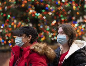 Thursday, Dec. 3, 2020 in New York. What’s normally a chaotic, crowded tourist hotspot during the holiday season is instead a mask-mandated, time-limited, socially distanced locale due to the coronavirus pandemic. (AP Photo/Mark Lennihan)